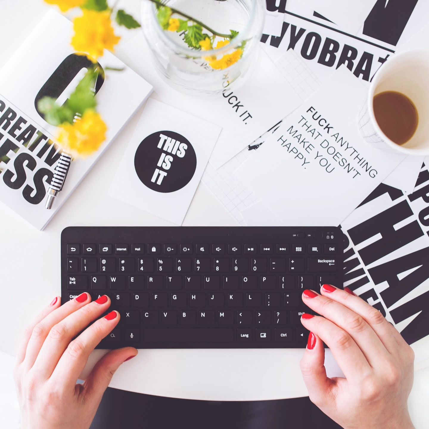 Girl writing on a black keyboard 6469